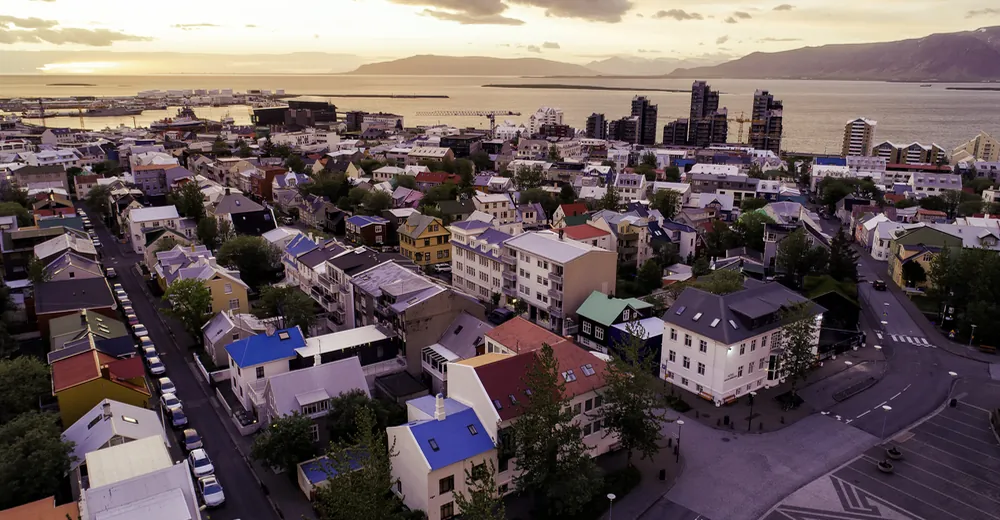 Reykjavík rooftops, the coast and mountains beyond the city