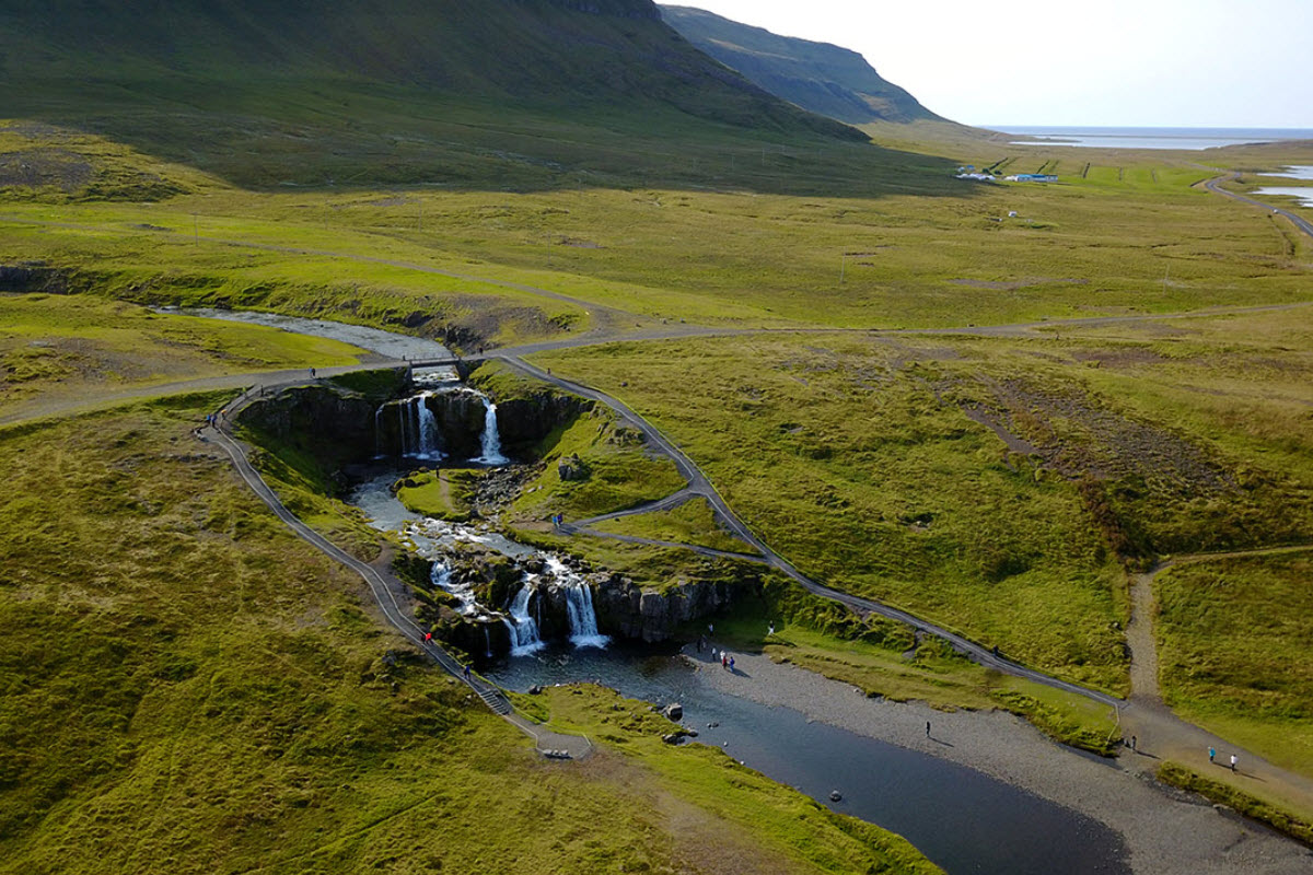 Grundarfoss Waterfall by Kirkjufell mountain in Grundarfjordur