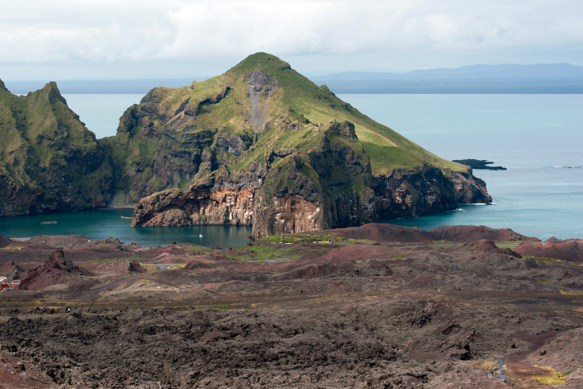 Multi colored lava landscape can be found in Vestmannaeyjar island 