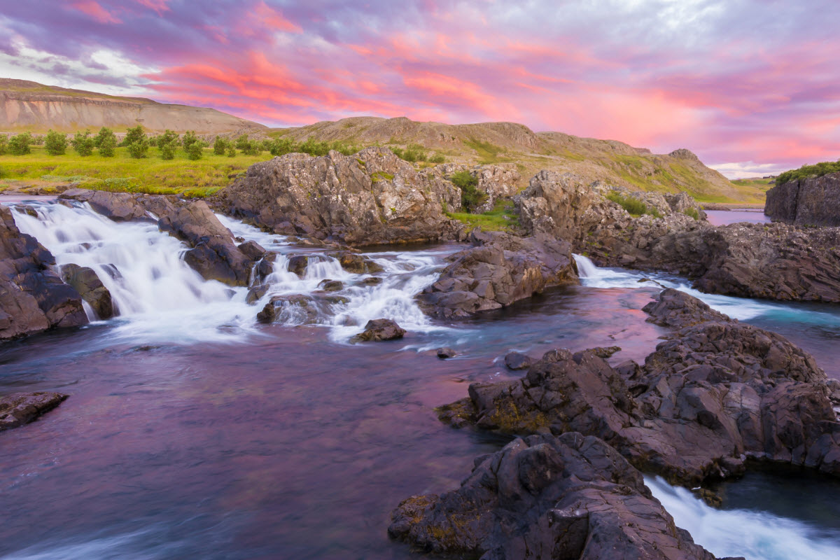 Sunset by the waterfall Glanni in west Iceland