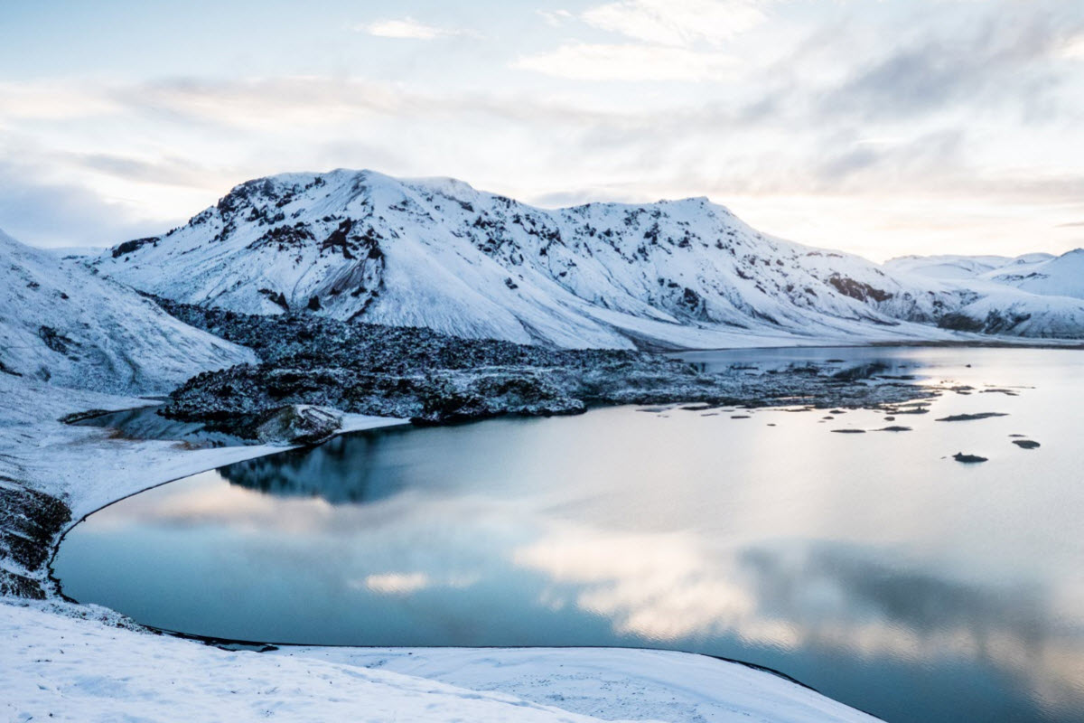 Blue lake near volcano Hekla during winter in Iceland