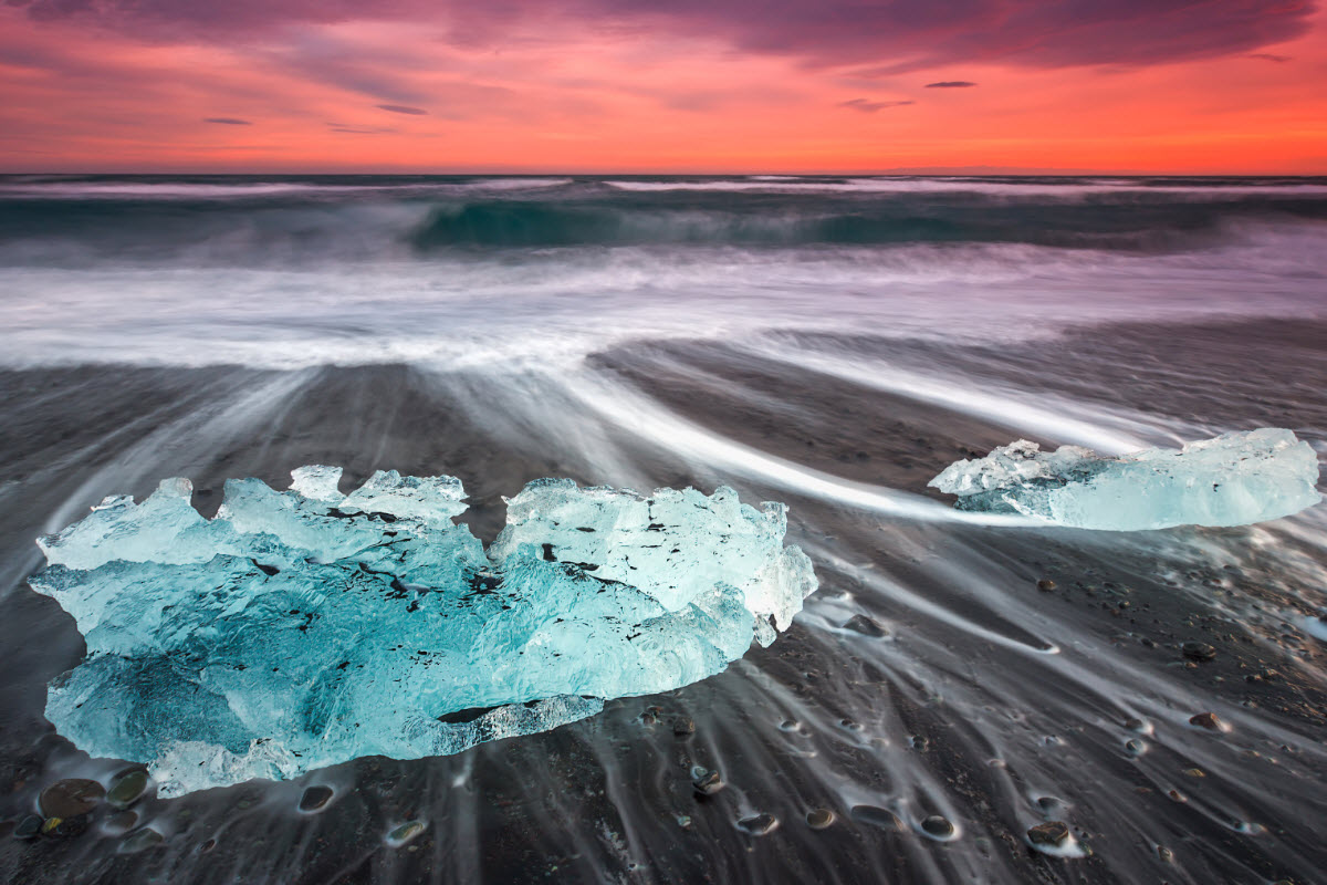 Sunset at the black volcanic beach near jokulsarlon in Iceland