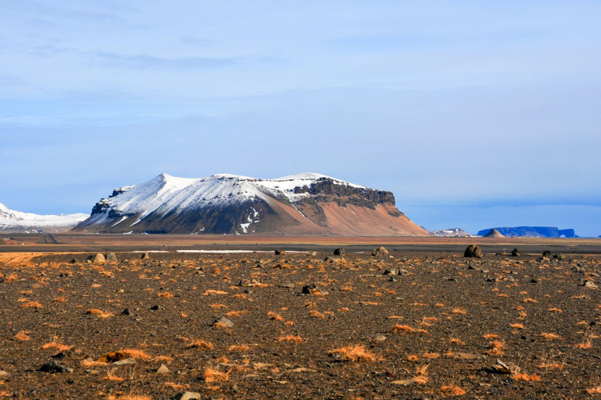 The view over Petursey mountain from Solheimasandur black sand beach 