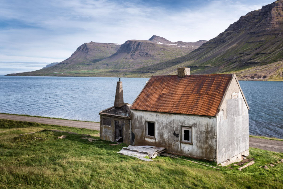 Old abandoned house in Seydisfjordur fjord 