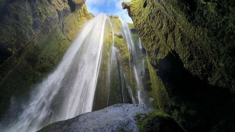 Gljúfrabúi waterfall inside its mossy canyon
