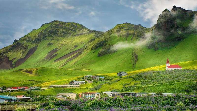 Vík village and church beneath South Coast mountains