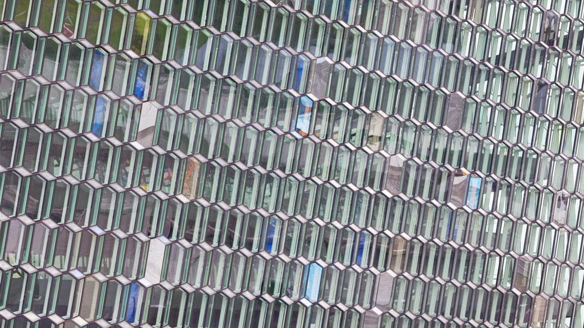 Geometric glass modules across the façade of Harpa Concert Hall