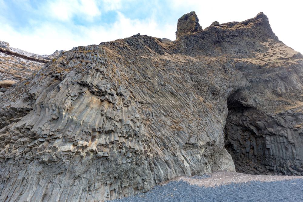 Dark Iceland sea cave and black sand landscape connected with The Odyssey filming-location atmosphere