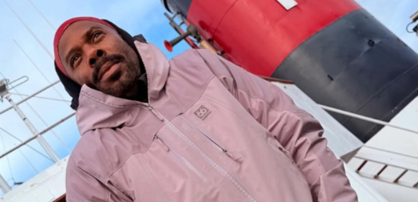 Colman Domingo wearing a pink jacket by the harbour in Iceland