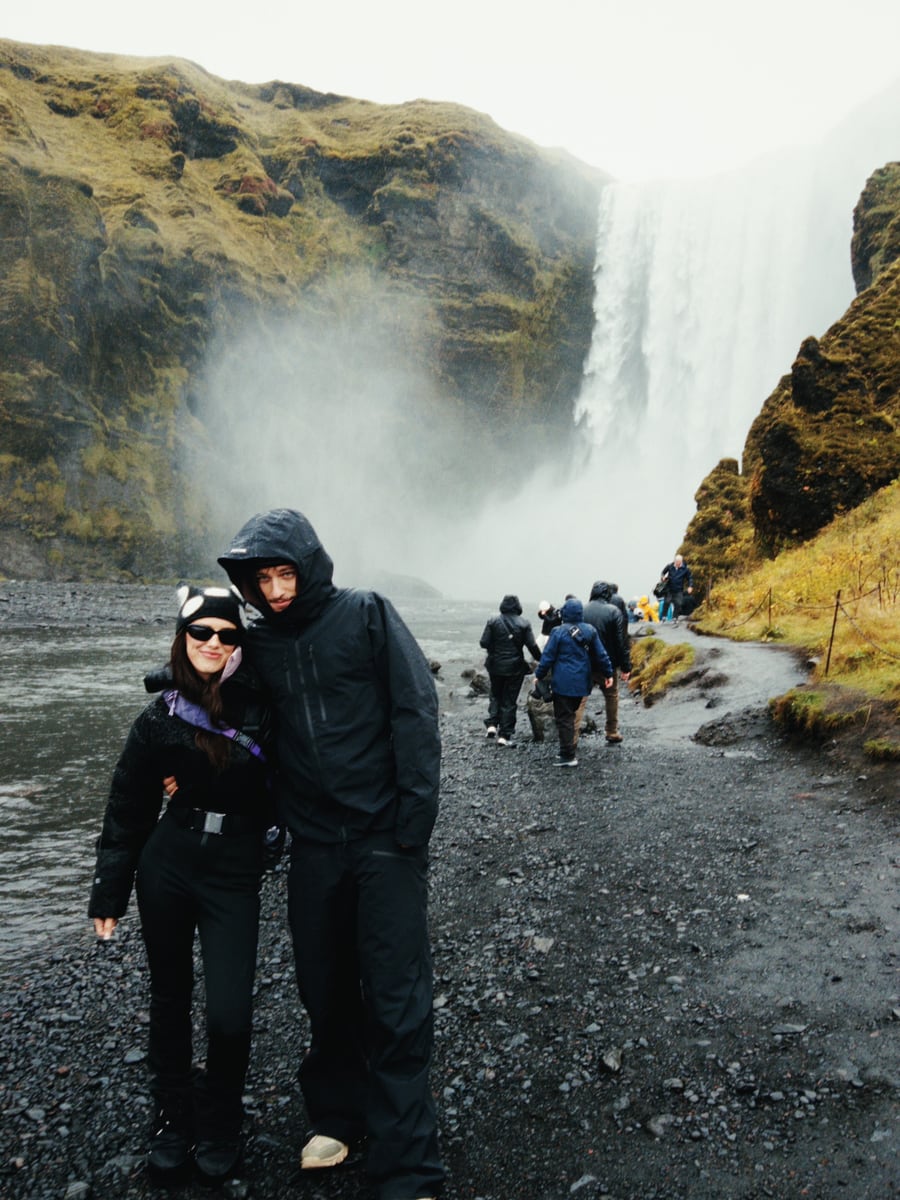 Millie Bobby Brown and Jake Bongiovi beside Skógafoss waterfall in Iceland