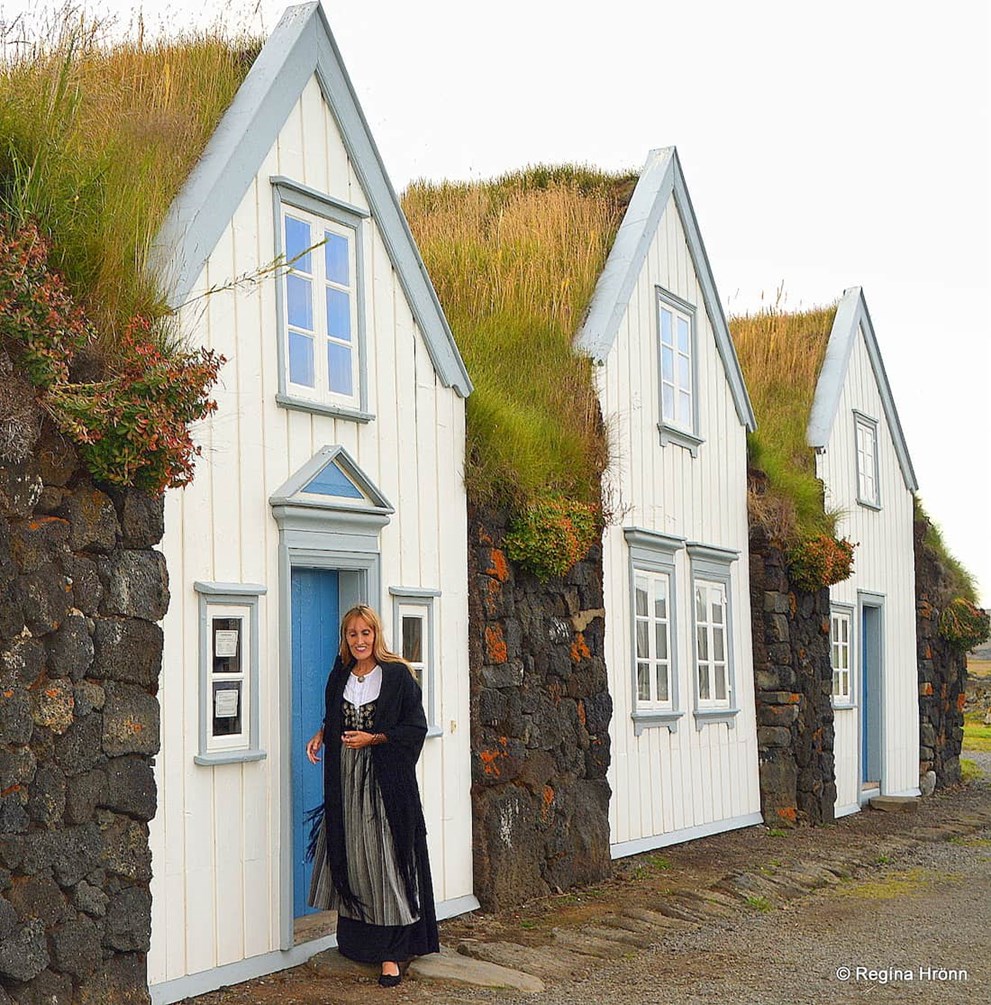 Woman with the Icelandic National Costume in turf houses