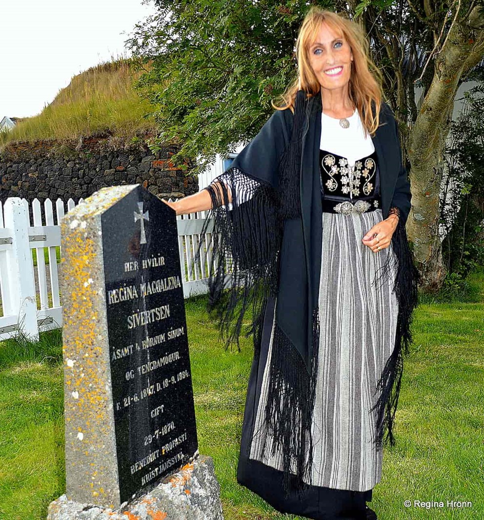 Woman with Icelandic National costume visiting her relative grave