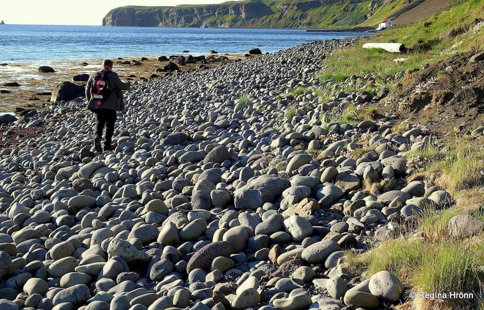 Man walking on a rocky beach