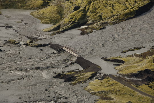 Bridge in danger in a glacial outburst flood