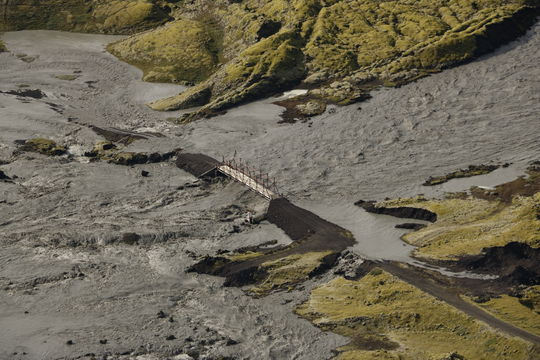 Bridge in danger in a glacial outburst flood