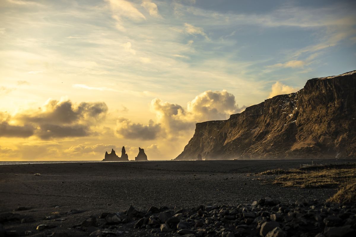 Sunset on the black-sand coast before the return to Reykjavík